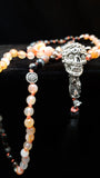 Hand Knotted, Zen Black & Fire Agate Mala with a Twisted touch. A Brass Skull Guru bead
